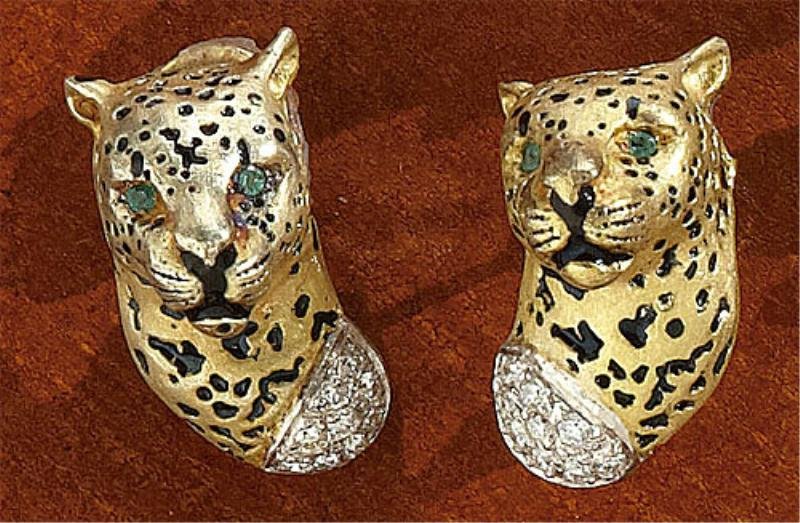 DIAMOND AND EMERALD LEOPARD EARRINGS: 14k yellow gold earrings depicting leopard heads with emerald eyes and collars set with eighteen round brilliant cut diamonds weighing .36ct.t.w. 17.4 grams.