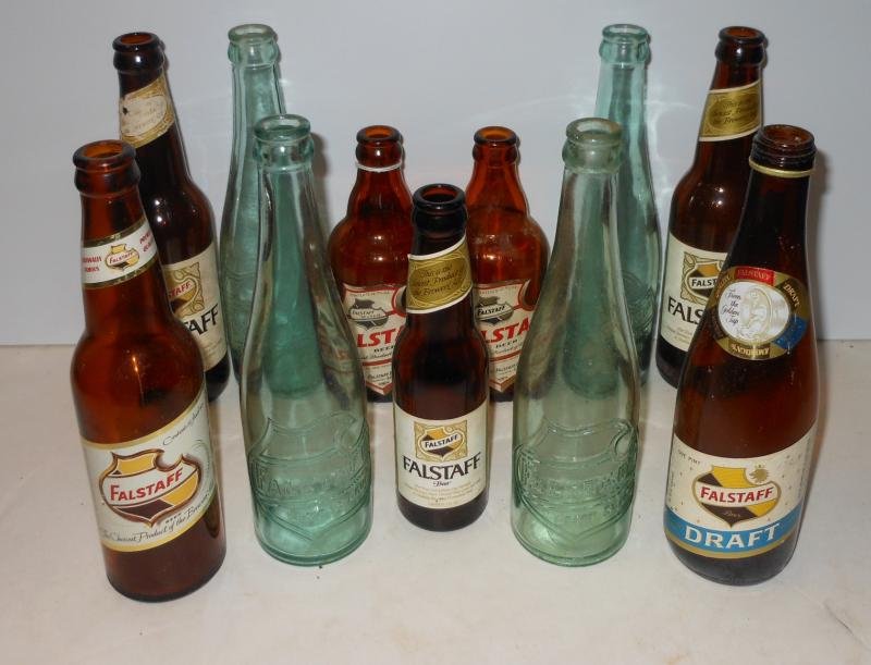 FALSTAFF BOTTLE COLLECTION: Eleven pieces, including 4 clear embossed, the rest with paper labels from vintage to late. Henry Herbst Collection
