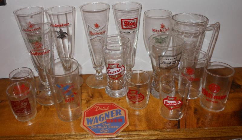 COLLECTION OF BEER GLASSES AND COASTER: Includes a rarely seen "Wagner" beer glass & coaster, with an assortment of Budweiser, Stag, Falstaff & other glasses. Henry Herbst Collection