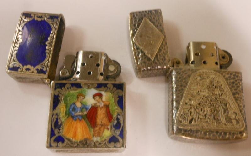 TWO STERLING LIGHTERS: One with enameled scene and cobalt surround, the other likely Guatemala.