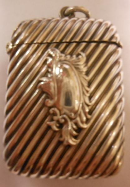 ENGLISH STERLING SILVER MATCH SAFE: Diagonal line decoration with cartouche, 1 3/8 x 2 1/4 in.