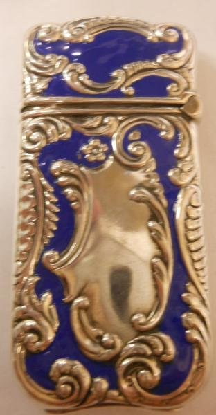 STERLING AND BLUE ENAMEL MATCH SAFE: Rococo motifs, 1 1/8 X 2 1/4 in.