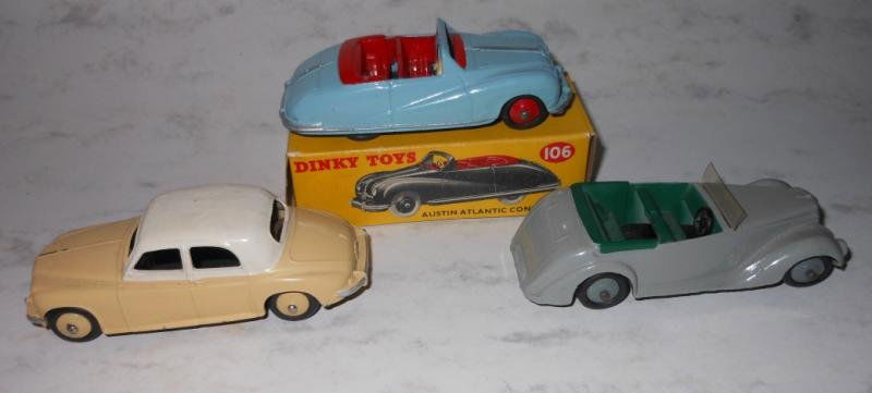 THREE DINKY TOY VEHICLES: All in very good condition, one with original box is Austin Atlantic Convertible 106 in sky blue, with Rover 75 having white top over pale yellow body, and Armstrong Siddeley in grey.
