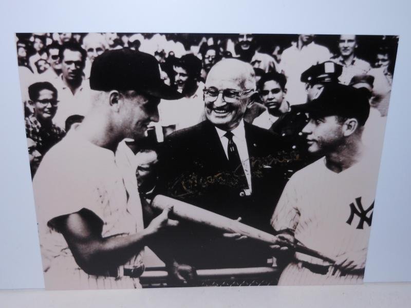 MICKEY MANTLE SIGNED 8 X 10 PHOTOGRAPH: With Harry S. Truman and Roger Maris, signed by Mantle in gold marker across Truman's chest, the signature is 'smudged'.
