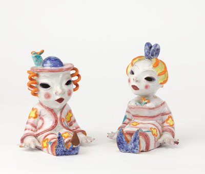 WALTER BOSSE, AUSTRIAN (1904-1979): BUCHSTUTZEN (bookends), a pair of painted and glazed red earthenware figures of seated children, one with impressed signature, both with pencil notation underfoot "July 1947", multiple imperfections.