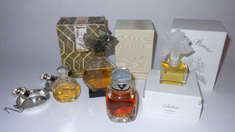 FOUR VARIOUS PARFUMES: Celadon (Lady Primrose's), 4 inches; Givenchy, Paris, 3 inches; Cavale, with metal form fitting case, 2 1/2 inches; Parure by Guerlain (sealed), 4 3/4 inches.