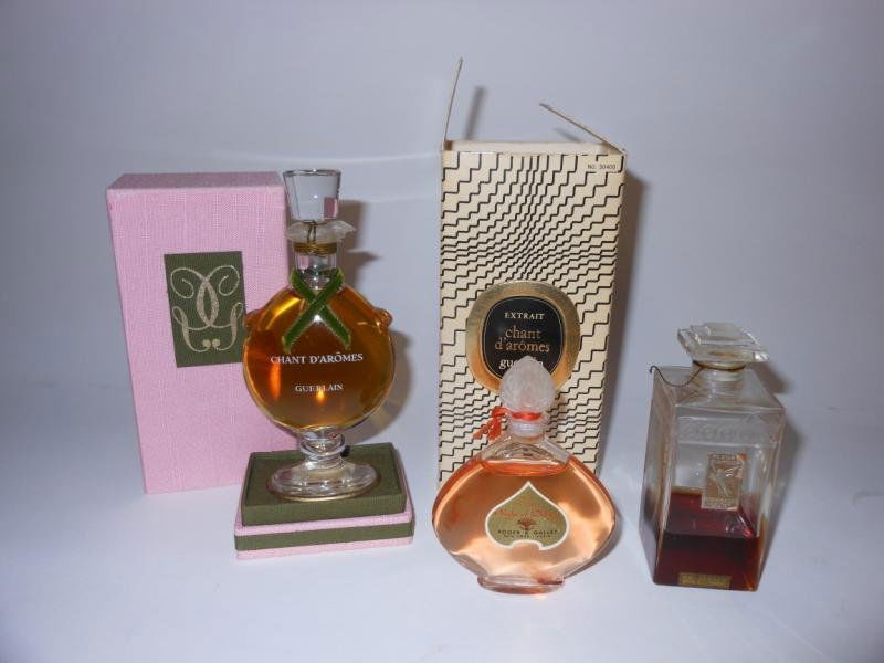 THREE COMMERCIAL PERFUMES: Chant d'Aromes by Guerlain, mint in box with outer box, 4 3/4 inches; Night of Delight, 3 1/2 inches, Fleur D'Amour, Roger & Gallet, 3 1/2 inches.