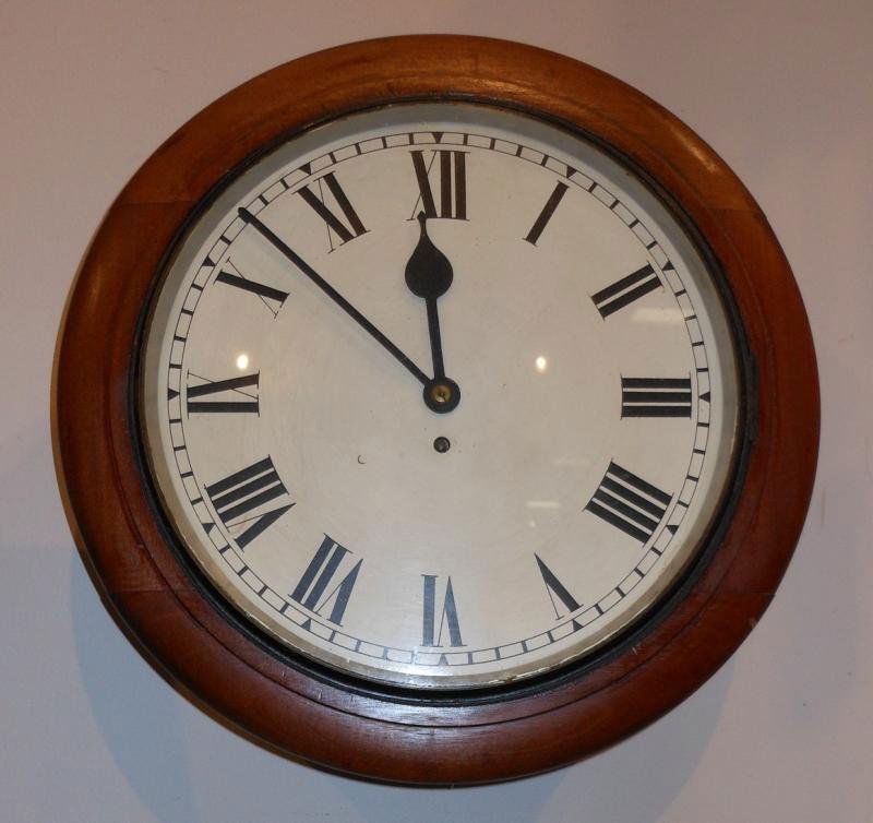 AMERICAN 19TH CENTURY WALL CLOCK: Circular case, with pendulum (small tear to tongue).