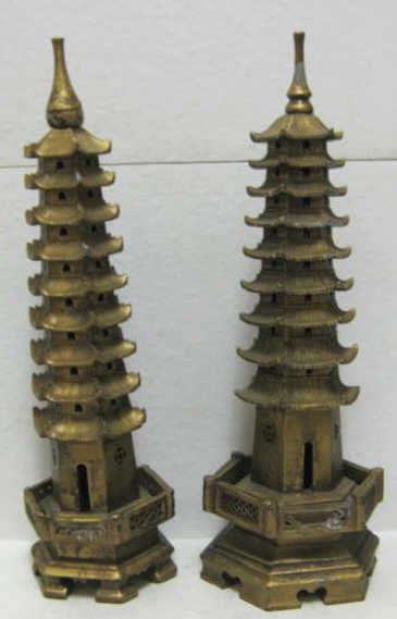 TWO SOUTHEAST ASIAN CARVED STONE PAGODAS: Each similarly modeled with nine-tiered roofs, on hexagonal bases, gilded, 19th/20th century. Heights 17 3/4 in. Provenance: Sold at Christie's, March 2001, Sale 9460, lot 1097 (The Duquette Collectio
