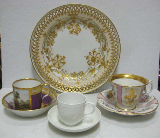 COLLECTION OF GERMAN PORCELAIN: KPM, Berlin Art Nouveau soup size plate with reticulated and beaded rim, raised gilt stylized floral decoration, bearing blue scepter and red imperial orb marks (d: 9 1/2"), together with three cup/sa