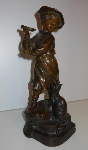 FRENCH BRONZE FIGURE OF A YOUNG BOY AND CAT: Young male figure with upheld arm with food and inquisitive cat on stepped base at his feet, brown patina, signed indistinctly with impressed "Louchet Ciseleur, Paris" seal. Height 9 7/8 in.