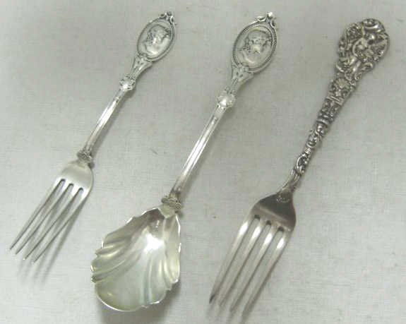 THREE ANTIQUE AMERICAN SILVER FLATWARE PIECES: Gorham sterling silver dinner fork, "Versailles" pattern (6 3/4"), 1888 and Hotchkiss & Schreuder coin silver preserve spoon and dessert fork in "Medallion" pattern, 1860-1869. Weight 3.4 troy ounces.