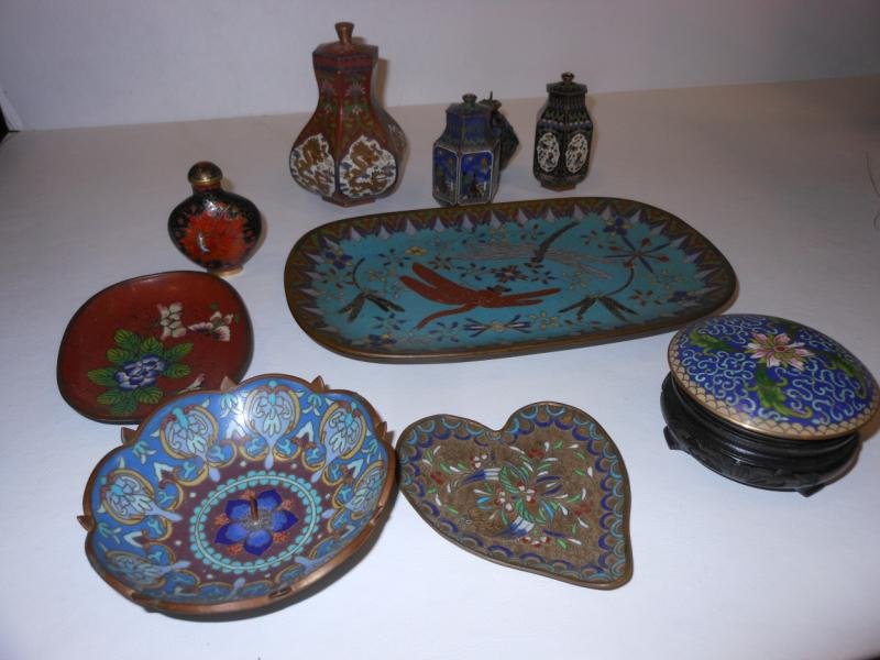 COLLECTION OF CHINESE CLOISONNE: Collection of ten assorted Chinese cloisonne pieces. Four diminutive urns with lids, snuff bottle with firebird motif, heart-shaped tray, candle votive, and tray with flying insect motifs.
