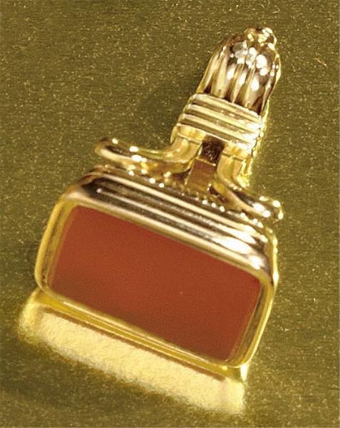 CARNELIAN SEAL PENDANT/FOB: 14k yellow gold fob with a cushion cut carnelian measuring 5/8 x 1/2 inch. 9 grams.