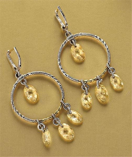 CITRINE DANGLING EARRINGS, JUDITH RIPKA: Sterling silver pierced earrings with lever backs in a twisted-circle design dangling oval faceted citrine stones. Earrings have six round faceted diamonds set in 18k gold with 18k yellow gold posts.