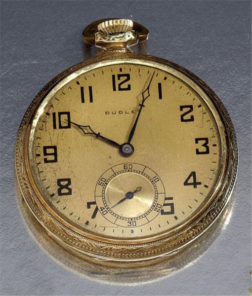 MASONIC POCKET WATCH, DUDLEY WATCH CO.: 14k yellow gold filled open face pocket watch with gold colored dial and black Arabic number markers. Watch has inset second hand dial and engraved cover with keystone shield. Movement 2580, with exhi
