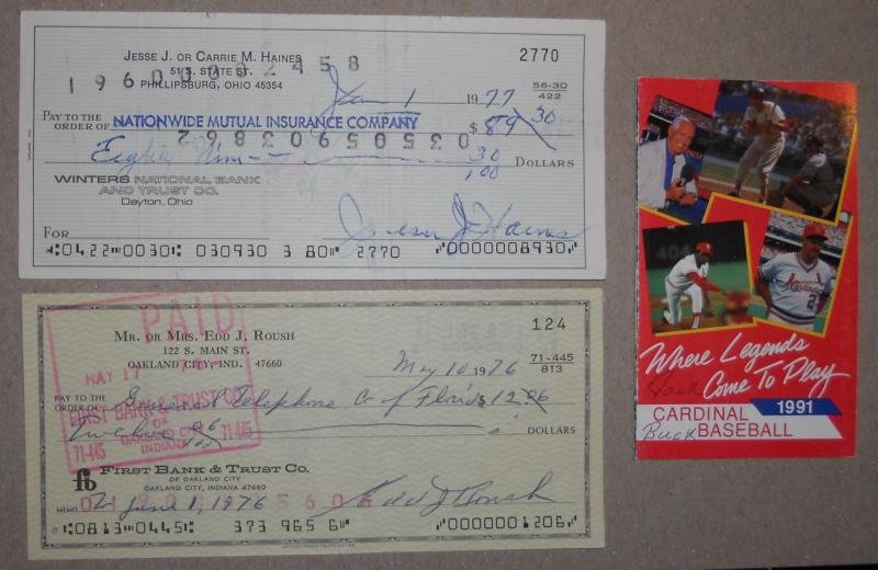 LOT OF 3 BASEBALL HALL OF FAME SIGNED ITEMS: St. Louis Cardinals announcer Jack Buck signed pocket schedule authenticated by JSA G36295, Jesse Haines cancelled personal check, and Edd Roush cancelled personal check.