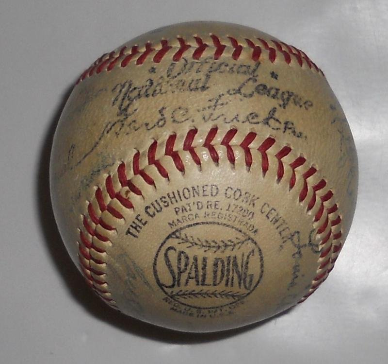 WW II ERA CARDINALS MUTLIPLE SIGNED BASEBALL: Likely 1943, as said to have been acquired at St. Louis Sportsman's Park in a "Buy a War Bond and get an Autographed Baseball" give away, a "Ford C. Frick" ball, with 13 signatures, including Stan Mus