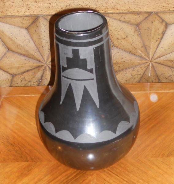 JUANITA GONZALES (1909-1988) SAND ILDEFONSO PUEBLO: San Ildefonso blackware pottery vase, black on black geometric decoration, signed "Juanita" underfoot. h: 10 1/2"