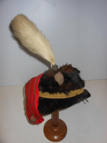 BRITISH HUSSAR'S OFFICER BUSBY WITH PLUME: Hawkes and Co., brown Sable fur with red wool kolpak, gold thread button and cap line with white feather plume.