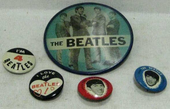 FIVE 'THE BEATLES' PIN-BUTTONS: Vari-Vue lenticular pin with picture of the four musician inscribed THE BEATLES and Paul McCartney portrait inscribed I LOVE PAUL with Green Duck Co., four small buttons; portraits of George Harrison 