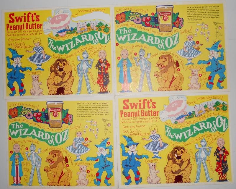 FOUR SWIFT'S PEANUT BUTTER CARDBOARD PUNCH-OUT: PREMIUMS Wizard of Oz MOBILES, double sided with different images to both sides, 1950s, all in excellent condition, together with a promotion photograph of their lunch meats.