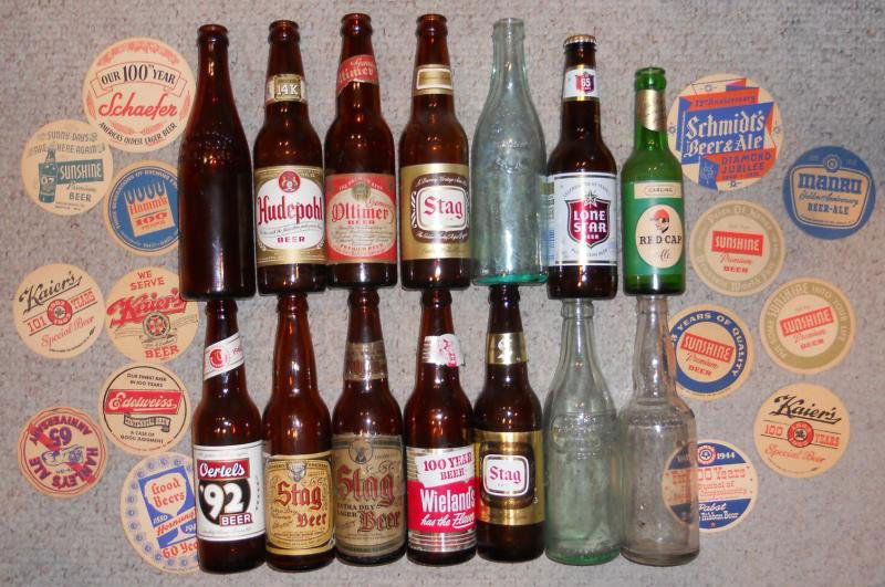 COLLECTION VINTAGE BOTTLES & COASTERS: Old anniversary beer coasters, and assorted bottles including Hudepohl, Stag Extra Dry Lager, Stag Extra Dry Pilsner, Stag, Oertels '92, Red Cap, Oltimer, Bellaire, Wieland's and more.
