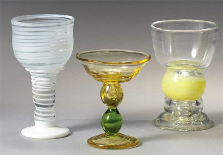 JOEL PHILIP MYERS, AMERICAN (B. 1934): Three blown art glass goblets; yellow and green small compote with air bubble, clear and white stripe goblet and clear glass goblet with yellow ball stem