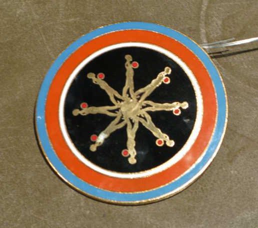 ERNEST TROVA, AMERICAN (1927-2009): Falling Man medallion, enamel on brass, stamped ET on verso. 2 1/2 inch diameter