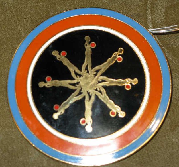 ERNEST TROVA, AMERICAN (1927-2009): Falling Man medallion, enamel on brass, stamped ET on verso. 2 1/2 inch diameter