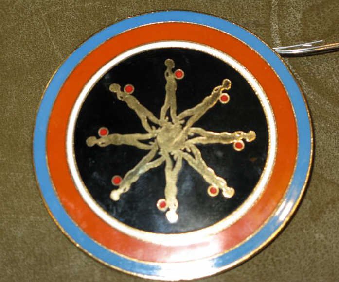 ERNEST TROVA, AMERICAN (1927-2009): Falling Man medallion, enamel on brass, stamped ET on verso. 2 1/2 inch diameter