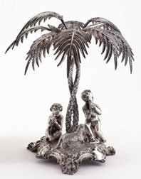 THOMAS BRADBURY & SONS, SHEFFIELD: Plated silver centerpiece sculpture, pastoral scene of allegorical children playing musical instruments with sheep under palm tree, on tripod rococo style base, 19th century. Height: 12 1/2 inches