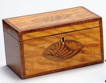 ENGLISH GEORGE III INLAID TEA CADDY: Rectangular, crossbanded to all sides, showing conch shell medallions on top and front, interior double lidded, late 18th century. 5 x 9 x 5 inches