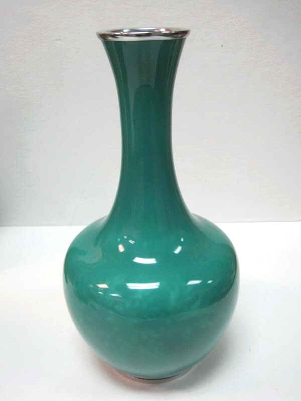 JAPANESE SHIPPO STUDIO CLOISONNÉ VASE: Bottle form with flared rim. Floral decoration under apple green ground, marked. Height: 9 1/2 inches