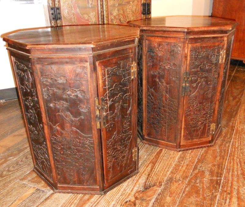 PAIR OF ANTIQUE CHINESE OCTAGONAL DRUM TABLES: Solid tops, over the eight hand carved vertical panels with various landscapes with figures and clouds, likely early 20th century, imp. Height 24 1/2, width 20, depth 19 1/2 in.