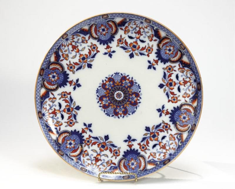 MINTON PORCELAIN CHARGER: "Rouen" pattern, decorated in Japanese style in blue underglaze and iron red overglaze, printed mark, 1881. Diameter 15 inches.