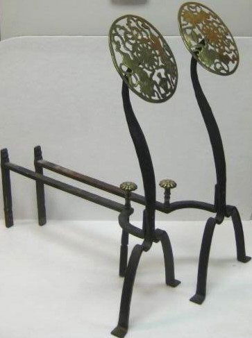 PAIR ENGLISH 19TH CENTURY ANDIRONS: Pierced brass disc form finials with scrolling foliate around two lion decoration, wrought iron stems and bases. Height 27 1/2 in.
