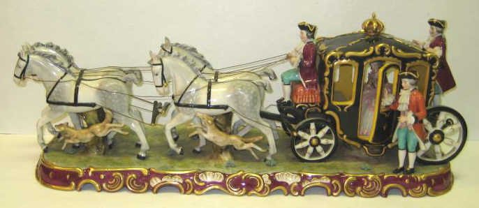 GERMAN PORCELAIN COACH GROUP: Driven by four horses with assisting dogs, attendant helping out a lady seated inside, bearing mark of F.W. Wessel, Frankenthal, after 1949. Length 25 in.