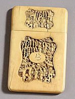 CHINESE CARVED IVORY CARD CASE: Each side of case and lid carved with a shaped reserve in high relief of figures amongst trees and buildings, 19th/20th century. 4 3/8 x 2 7/8 in.