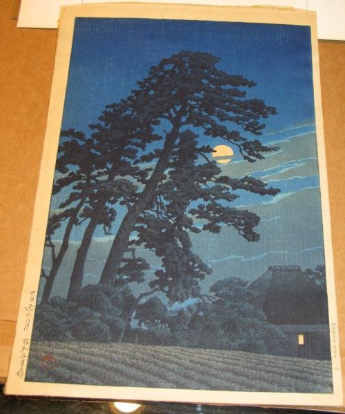 KAWASE HASUI, JAPANESE (1883-1957): MOON AT MEGOME, color woodblock, published by Watanabe, stamped signature of Kawase Hasui lower left, Watanabe stamp lower right in margin, framed. 15 1/2 x 10 1/4 in.