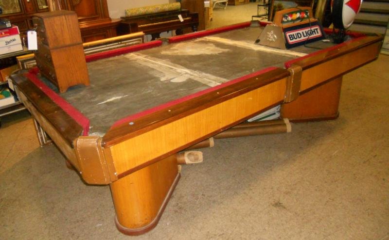 BRUNSWICK-BALKE-COLLENDER POOL TABLE: The "COMMANDER" model, (1934-1946), Designed by Paul C. Perrin, streamline modern design having a three piece slate top with Rosewood rail caps over the bleached Mahogany finished frame.