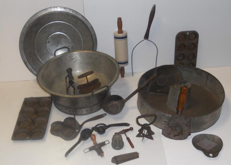 COLLECTION OF VINTAGE KITCHENWARE: Most tin, including large lidded pot and large cake pan, with graters, cutters, ladles, muffin pans, pie scoop, porcelain rolling pin and more.