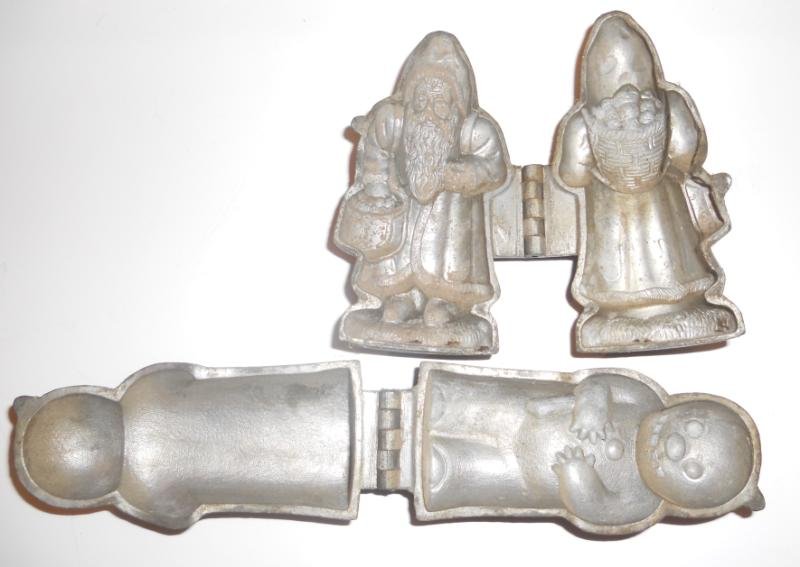 TWO CHRISTMAS RELATED PEWTER ICE CREAM MOLDS: Vintage pieces by "S & Co.", Santa Claus and a snowman, marked 427 and 601 respectively, 4 1/2".