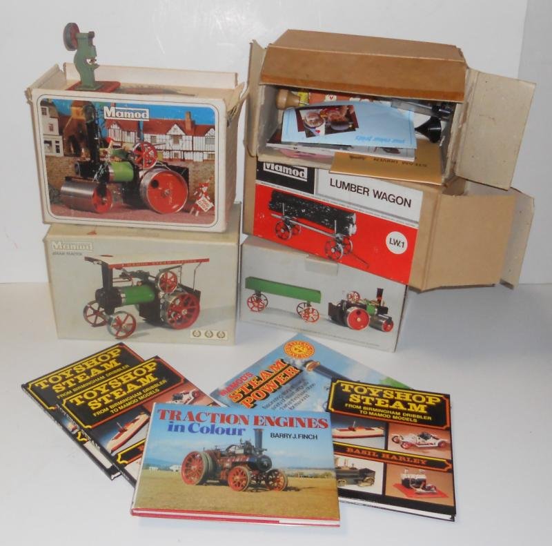 COLLECTION OF MAMOD STEAM ENGINE ITEMS: Consisting of a "TEI" steam tractor in box, Steam Roller in box, Lumber Wagon in box, Open Wagon in box, vintage Mamod press.