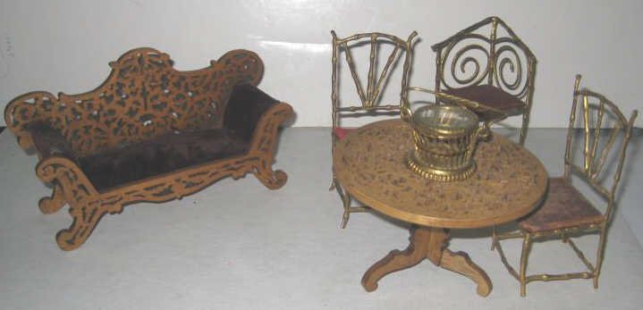 VINTAGE DOLLHOUSE FURNITURE: Pierced wood sofa with velvet upholstery and round table with three gilt metal chairs and glass lidded basket, total 6 pieces.
