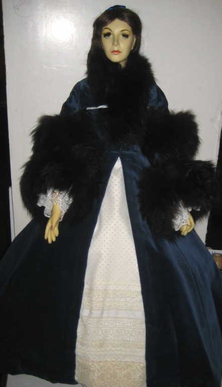 28" PAUL CREES WAX PORTRAIT DOLL, SCARLETT': Wearing cream laced dress and fur trimmed dark blue velvet coat, signed and dated on a neck, 1982.