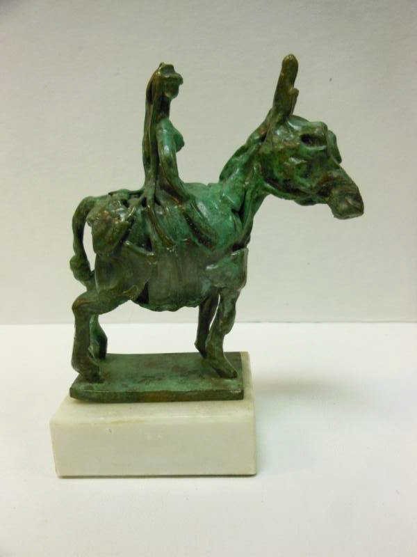 JOHN KEARNEY, AMERICAN/CHICAGO (B.1924): Bronze statue of a donkey and figure on a white marble base with green patina, entitled "Godiva on a Burro". Height 8 in., length 6 1/2 in., width 3 in.