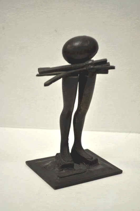 ERNEST TROVA, AMERICAN (1927-2009): Bronze sculpture of a pair of legs with cast spools, egg, and bundled rods, and set on a square metal base. Height 8 1/2 in., base 4 3/4 x 4 1/4 in.