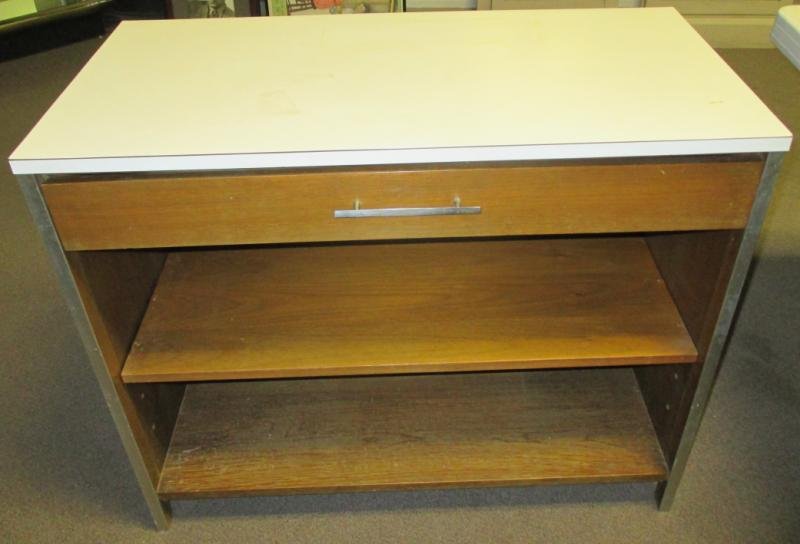 PAUL MCCOBB FOR CALVIN FURNITURE CO.: White formica top, over single drawer with shelf below. Height 30, width 36, depth 18 in.