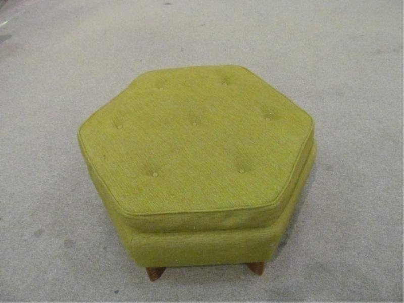 FRANK LLOYD WRIGHT FOR HERITAGE HENREDON: Ottoman of hexagonal form upholstered in green fabric having Taliesin design to leg edges. Height 16, diameter 31 in.